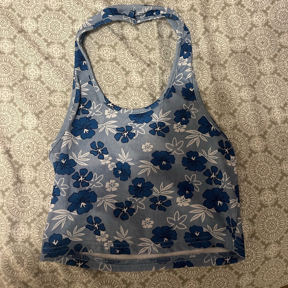 Crop top. Goes cute with a cute pair of shorts. Blue, with flowers.